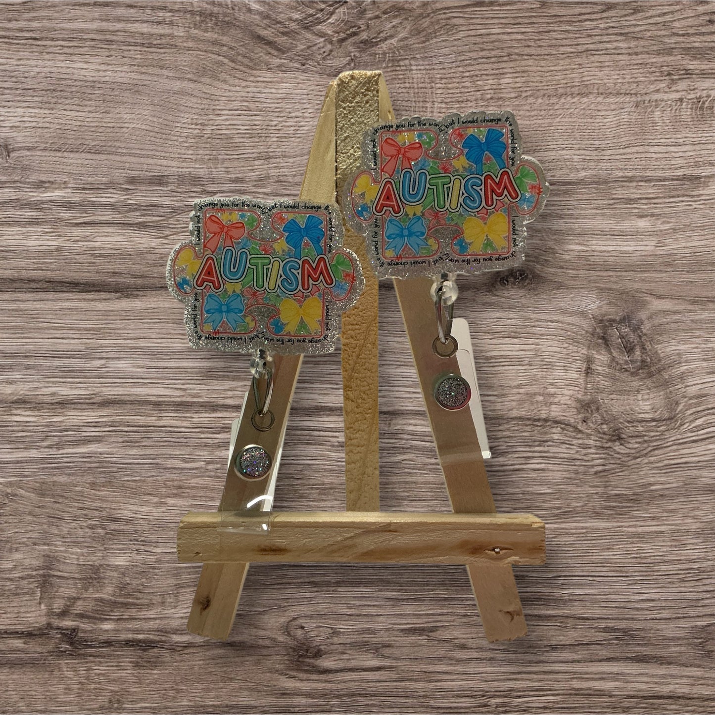 Autism with Colored Bows Badge Reel