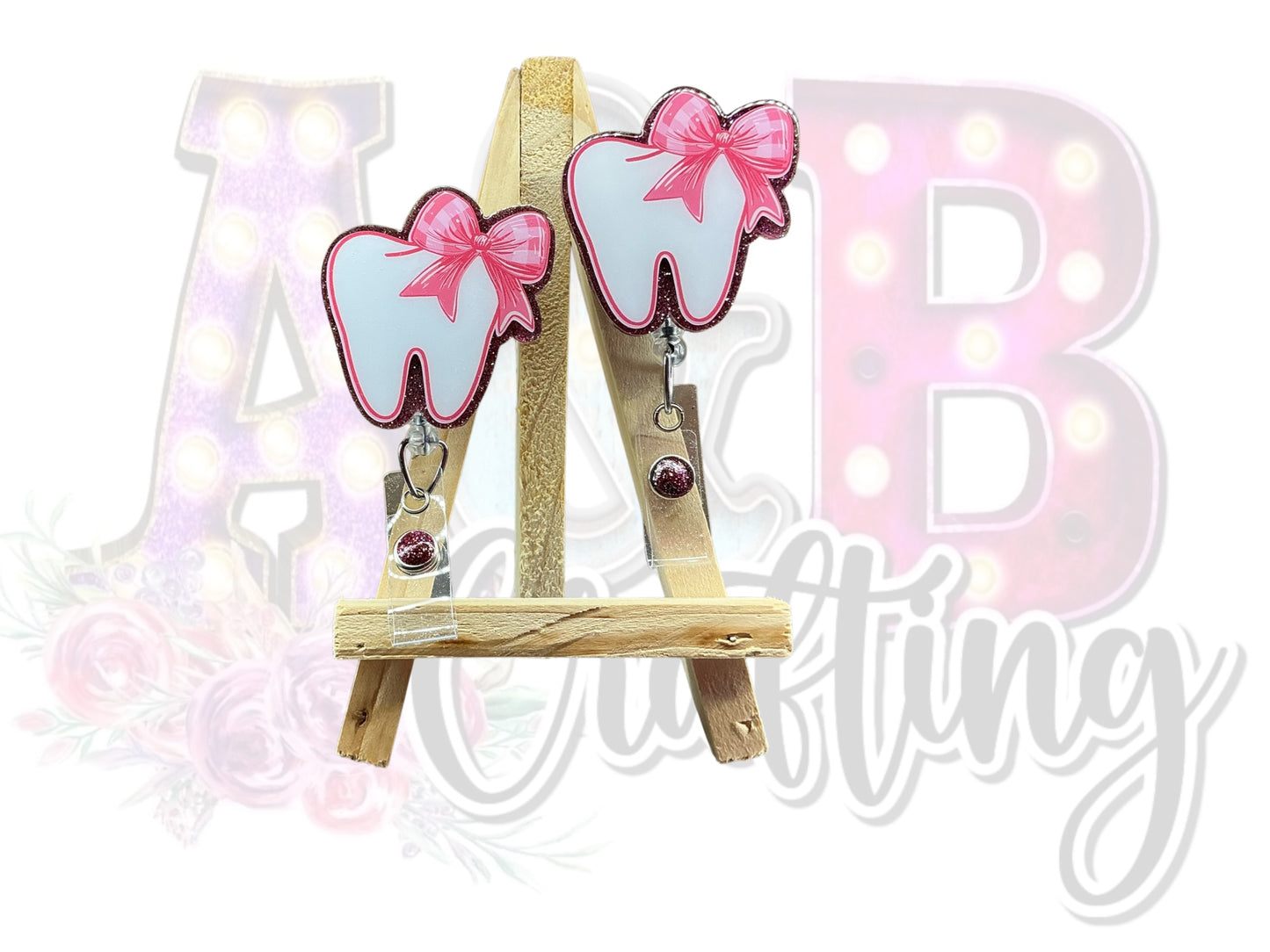 Tooth with small pink bow Badge Reel