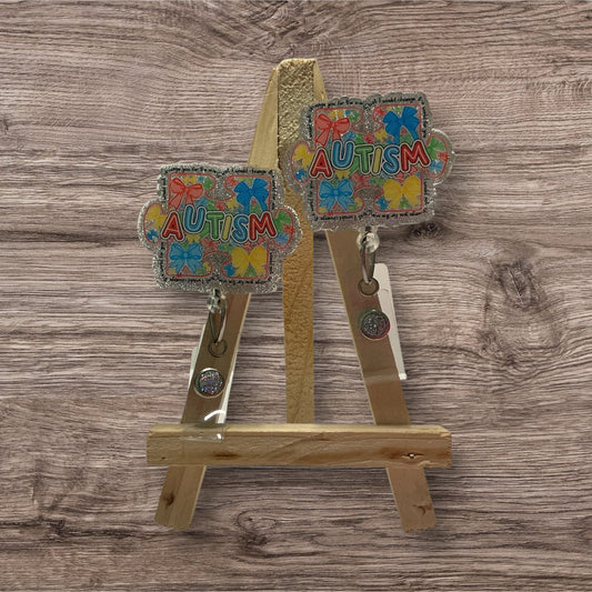 Autism with Colored Bows Badge Reel